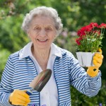 image of independent living resident with flowers