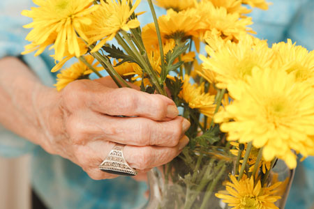 Image of senior holding flowers